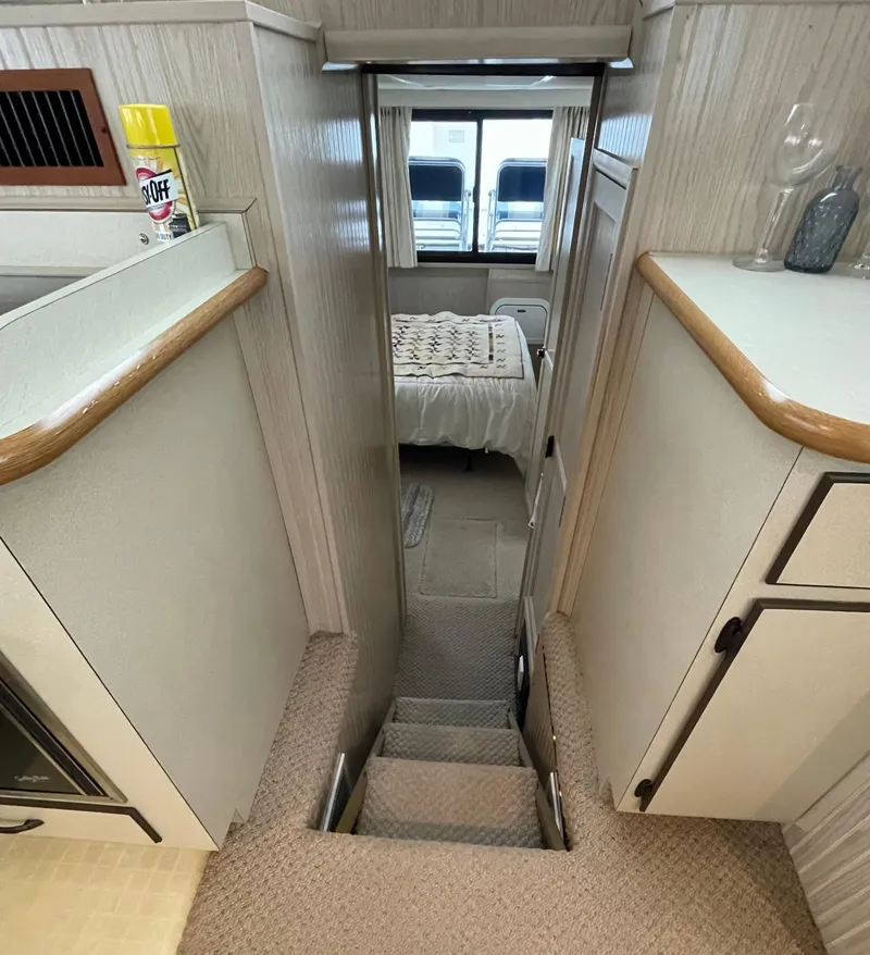 Slide: The Image of Interior of a 2003 Gibson 50 Classic boat with stairs leading to a bedroom. - 38