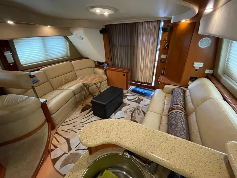 Slide: The Image of Luxurious interior of a 2008 Silverton Sport Bridge yacht with plush seating and elegant decor. - 37