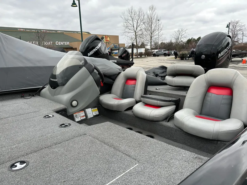 Slide: The Image of 2017 Tracker Pro Team 195 TXW boat with Mercury engine, featuring gray and red seating. - 3