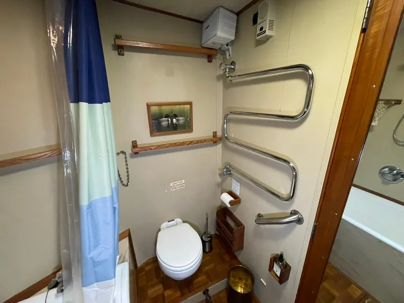 Slide: The Image of Bathroom interior of 1972 Grand Banks Alaskan 55 yacht with shower and towel rack. - 27