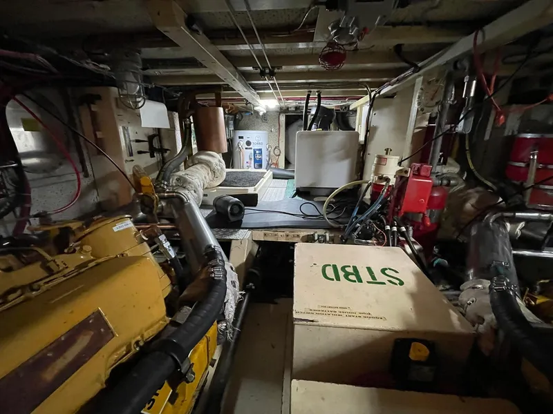 Slide: The Image of Engine room of a 1972 Grand Banks Alaskan 55 yacht, showcasing machinery and equipment. - 34