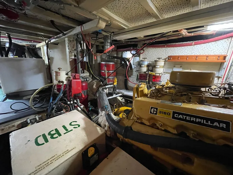 Slide: The Image of Engine room of 1972 Grand Banks Alaskan 55 with Caterpillar 3160 engine. - 36