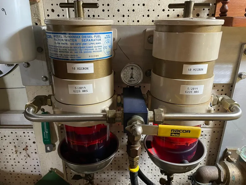 Slide: The Image of Dual diesel fuel filters on a 1972 Grand Banks Alaskan 55 boat engine. - 42