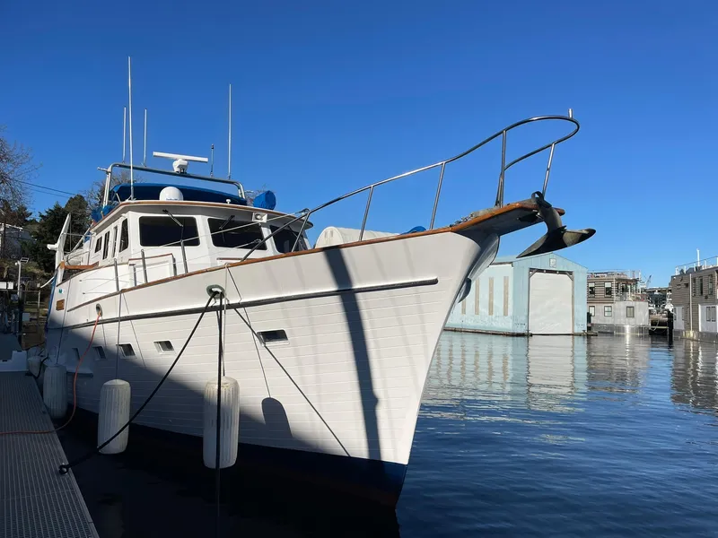 Slide: The Image of 1972 Grand Banks Alaskan 55 yacht docked on a sunny day. - 49