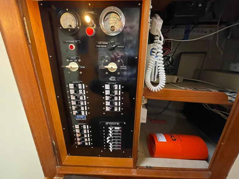 Slide: The Image of Electrical panel of a 1972 Grand Banks Alaskan 55 boat, featuring gauges and switches. - 7