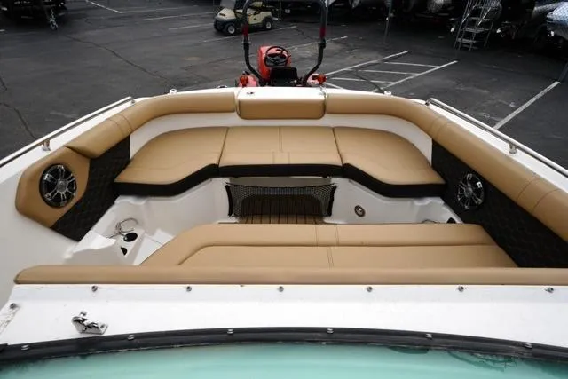 Slide: The Image of 2021 Sea Ray SDX 250 boat interior with tan seating and modern design. - 11