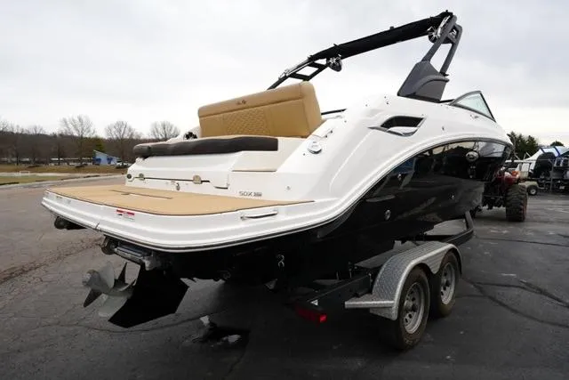 Slide: The Image of 2021 Sea Ray SDX 250 boat on trailer, rear view, parked outdoors. - 6
