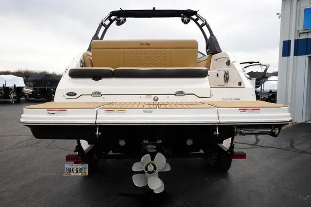 Slide: The Image of 2021 Sea Ray SDX 250 boat, rear view, showcasing swim platform and seating. - 7