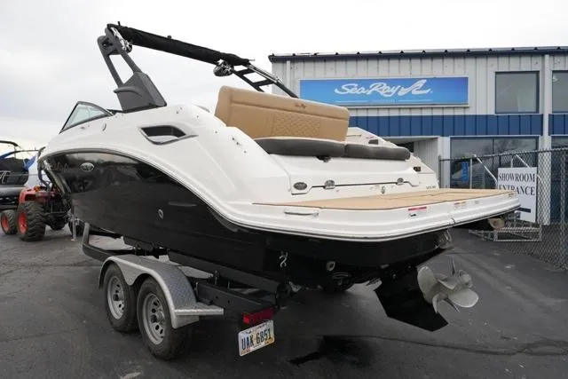 Slide: The Image of 2021 Sea Ray SDX 250 boat on trailer outside showroom. - 8