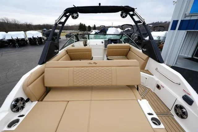 Slide: The Image of 2021 Sea Ray SDX 250 boat interior with tan seating and modern design. - 9