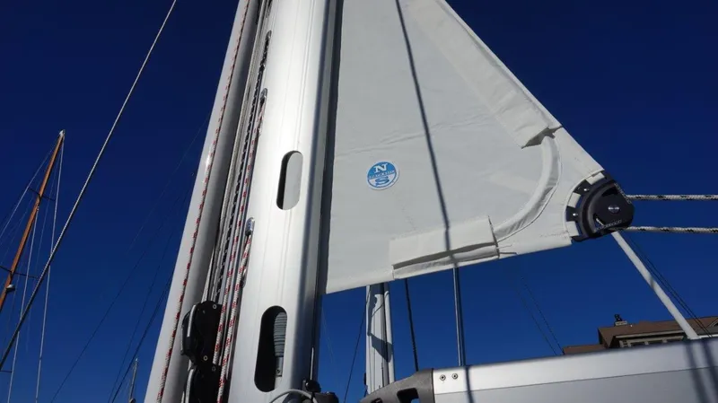 Slide: The Image of Sailboat mast and sail of 2008 Oyster 46 against clear blue sky. - 12