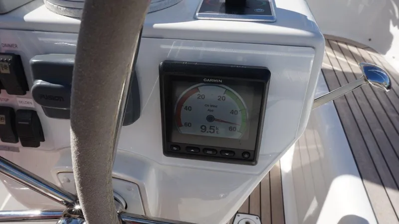 Slide: The Image of Control panel of a 2008 Oyster 46 yacht with Garmin display showing 9.5 knots. - 19