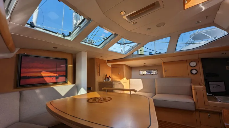 Slide: The Image of Luxurious interior of 2008 Oyster 46 yacht with skylights and elegant seating area. - 32