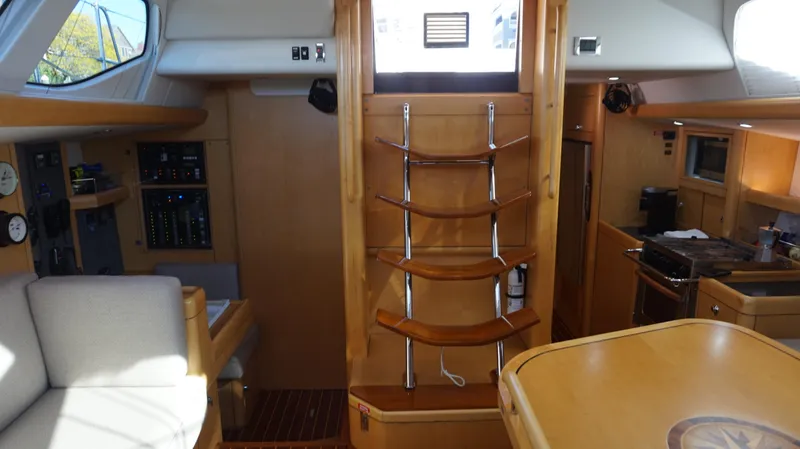 Slide: The Image of Interior of 2008 Oyster 46 yacht with wooden finishes and modern amenities. - 34