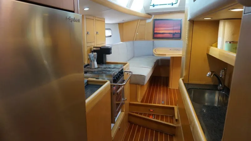 Slide: The Image of Interior of 2008 Oyster 46 yacht with modern kitchen and cozy seating area. - 38
