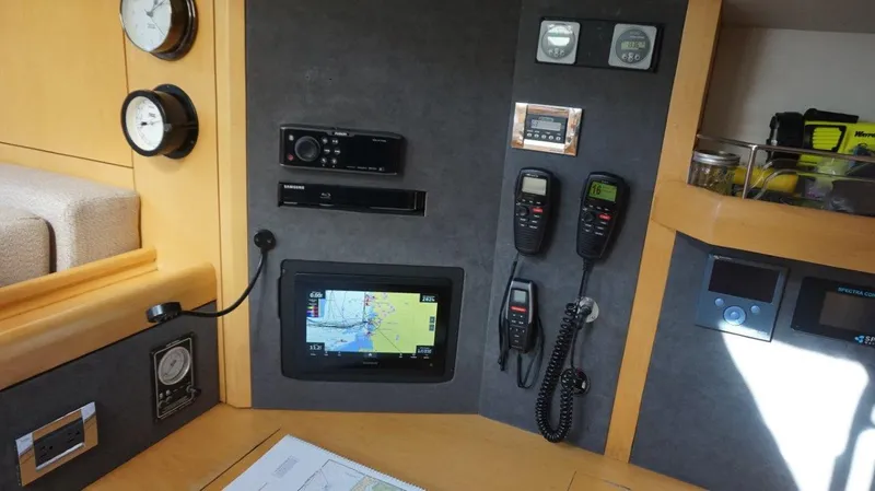 Slide: The Image of Navigation and communication equipment on a 2008 Oyster 46 yacht control panel. - 39