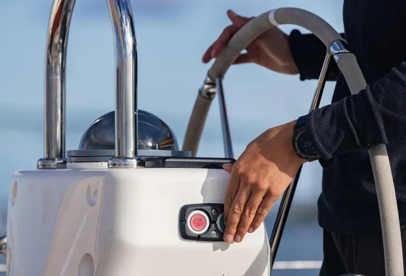 Slide: The Image of Person steering Oyster 46 yacht, 2008 model, focusing on helm controls. - 7