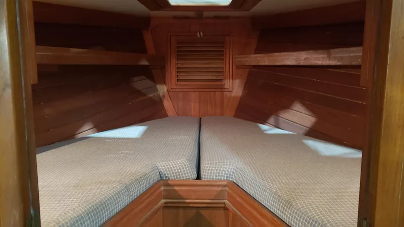 Slide: The Image of Interior cabin of 1981 Shannon 28 sailboat with wooden finish and twin berths. - 21