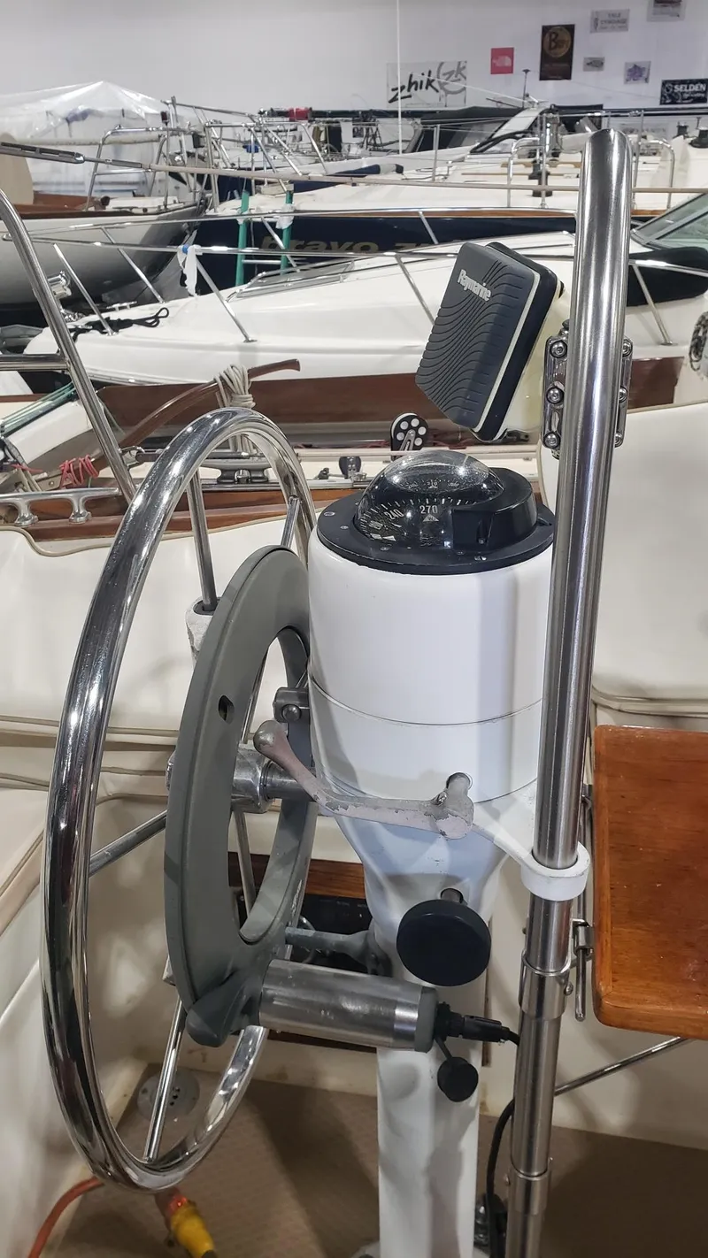 Slide: The Image of Steering wheel and compass on a 1981 Shannon 28 sailboat. - 36