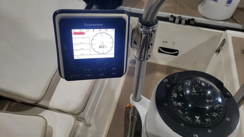Slide: The Image of Boat cockpit with Raymarine display and compass, Shannon 28, 1981 model. - 39