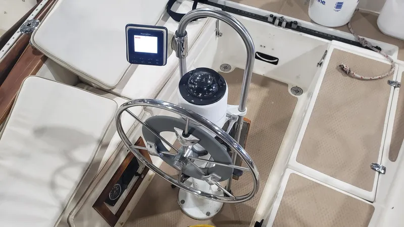 Slide: The Image of Steering wheel and navigation system on 1981 Shannon 28 sailboat deck. - 40