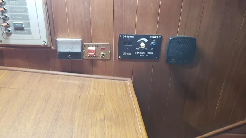 Slide: The Image of Wood-paneled control panel on 1981 Shannon 28 boat interior. - 41