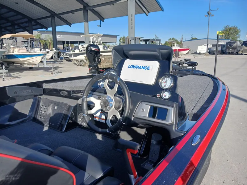 Slide: The Image of 2024 Nitro Z20 boat cockpit with Lowrance electronics, steering wheel, and modern dashboard. - 12