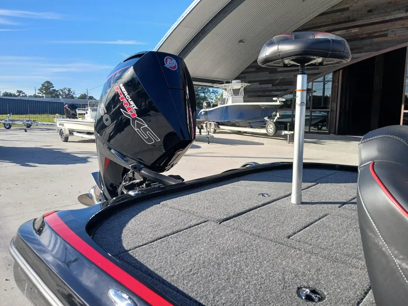 Slide: The Image of 2024 Nitro Z20 boat with Mercury Pro XS engine, docked outdoors. - 4