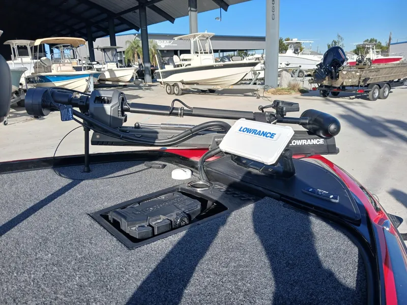 Slide: The Image of 2024 Nitro Z20 boat with Lowrance electronics and trolling motor at a marina. - 7