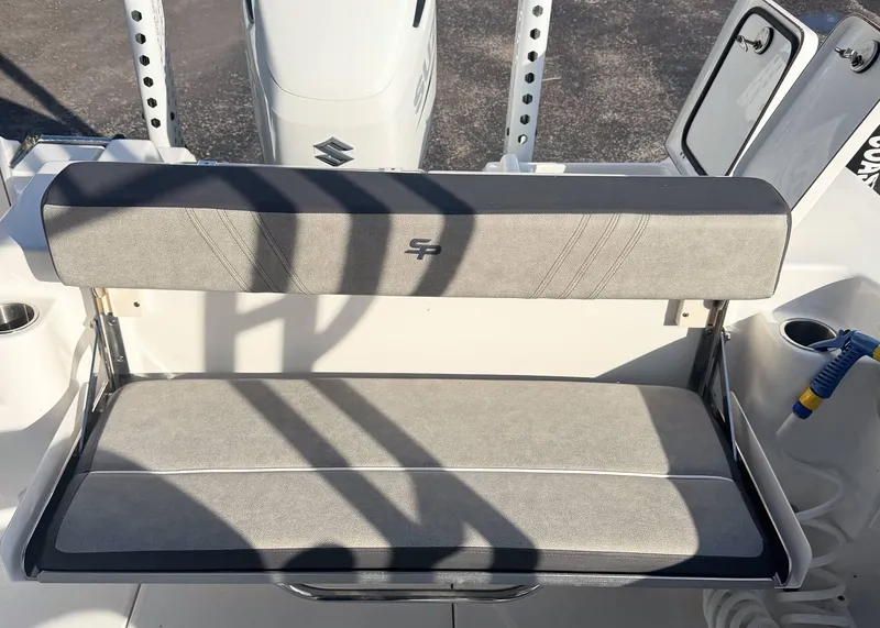 Slide: The Image of 2023 Sea Pro 240 DC boat seat with gray upholstery and cup holders. - 10