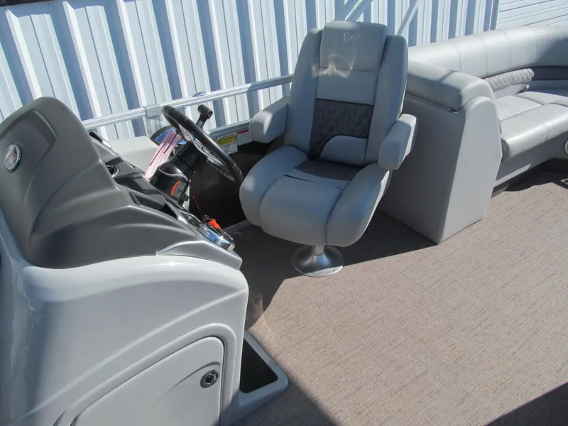 Slide: The Image of Interior of 2019 Ranger Reata 243C pontoon boat with gray seating and carpeted floor. - 10