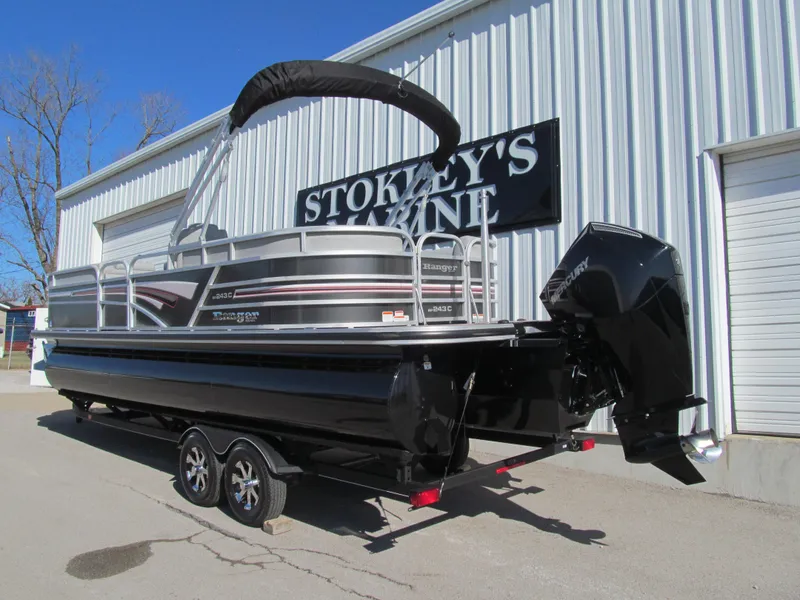 Slide: The Image of 2019 Ranger Reata 243C pontoon boat on trailer at Stokley's Marine. - 2