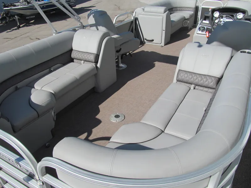 Slide: The Image of 2019 Ranger Reata 243C pontoon boat with 200 HP engine at a marina. - 4