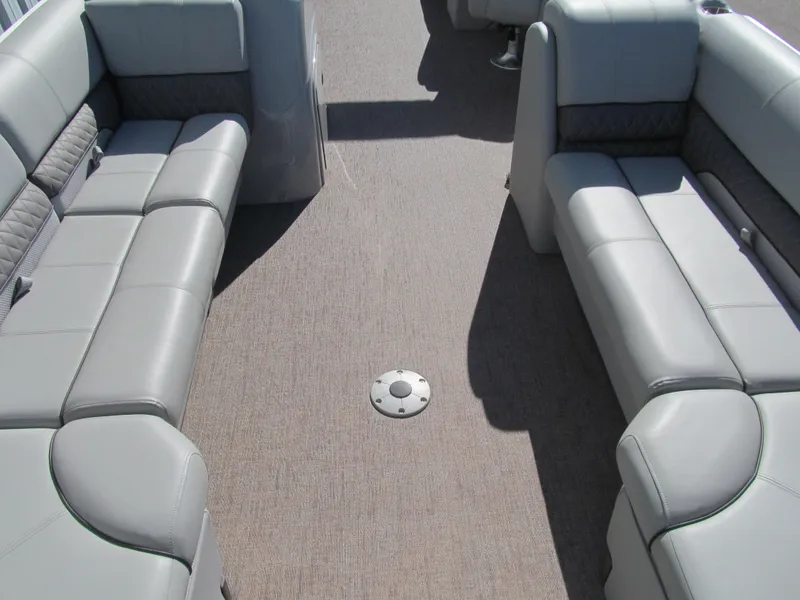 Slide: The Image of 2019 Ranger Reata 243C boat interior with steering console and cushioned captain's chair. - 8