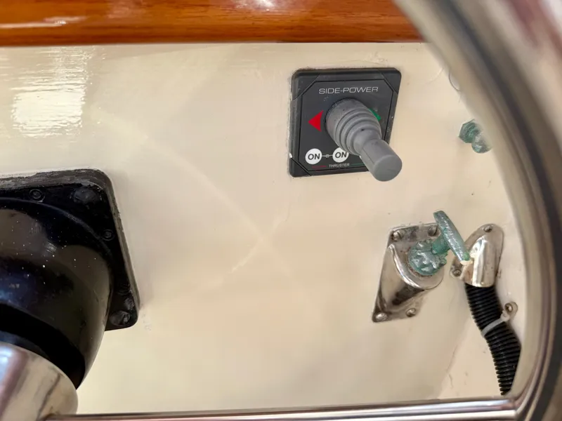 Slide: The Image of 1978 Dyer 29 Trunk Cabin boat interior with steering wheel and seating. - 11