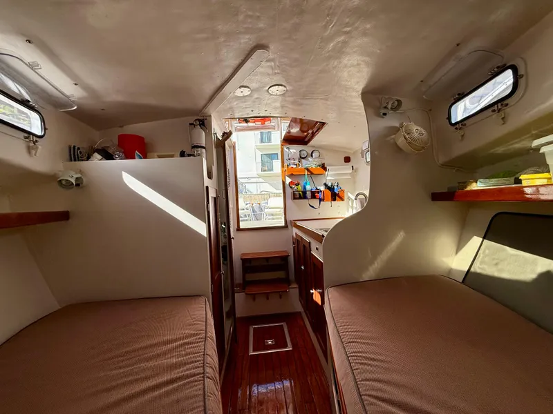 Slide: The Image of Interior of a 1978 Dyer 29 Trunk Cabin boat with cozy sleeping quarters. - 16