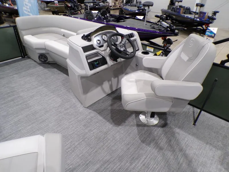 Slide: The Image of Interior of 2025 Godfrey Xperience 2286 SFLX boat, featuring modern helm and seating. - 13
