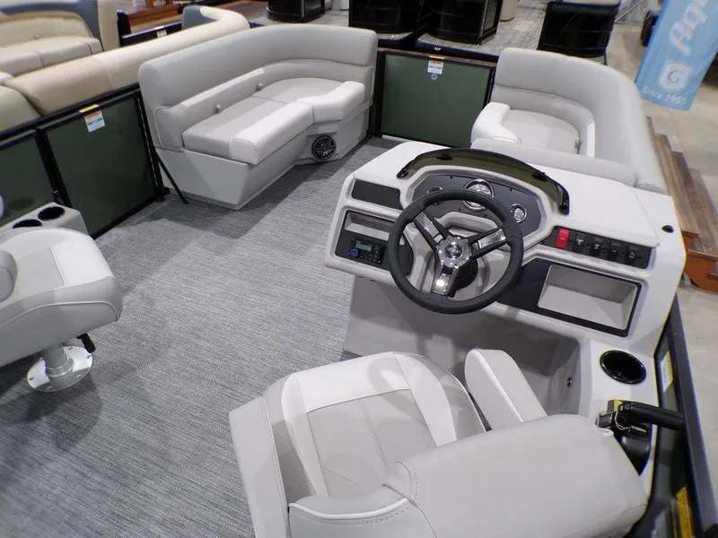 Slide: The Image of 2025 Godfrey Xperience 2286 SFLX boat interior with modern seating and steering console. - 14
