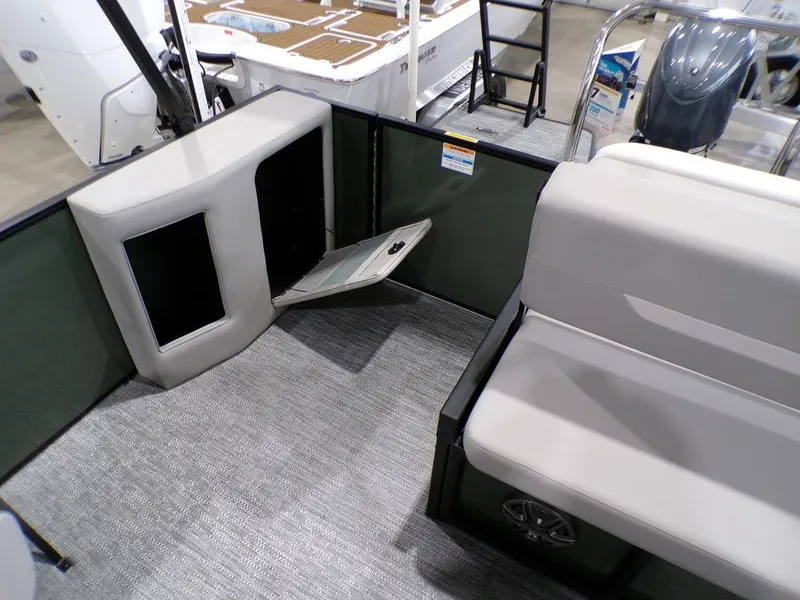 Slide: The Image of Interior of 2025 Godfrey Xperience 2286 SFLX boat, featuring seating and storage. - 16