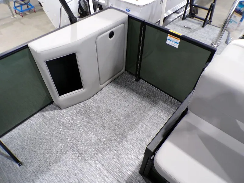 Slide: The Image of 2025 Godfrey Xperience 2286 SFLX boat interior with seating and storage area. - 18