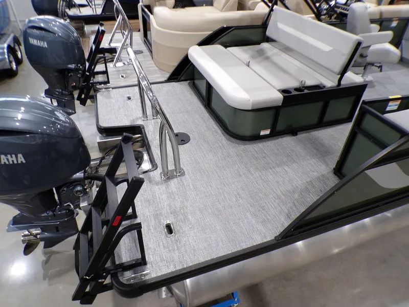 Slide: The Image of 2025 Godfrey Xperience 2286 SFLX pontoon boat with Yamaha engines, rear seating, and ladder. - 20