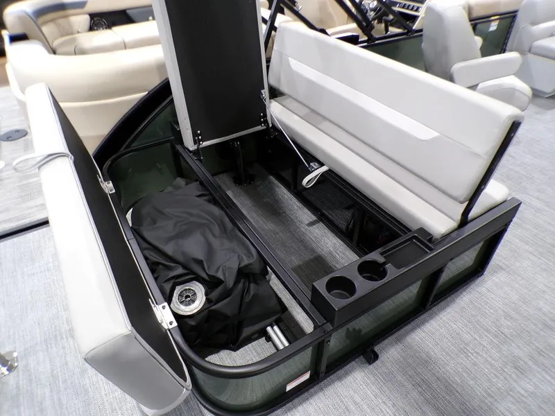 Slide: The Image of 2025 Godfrey Xperience 2286 SFLX boat interior with storage compartment and seating. - 21