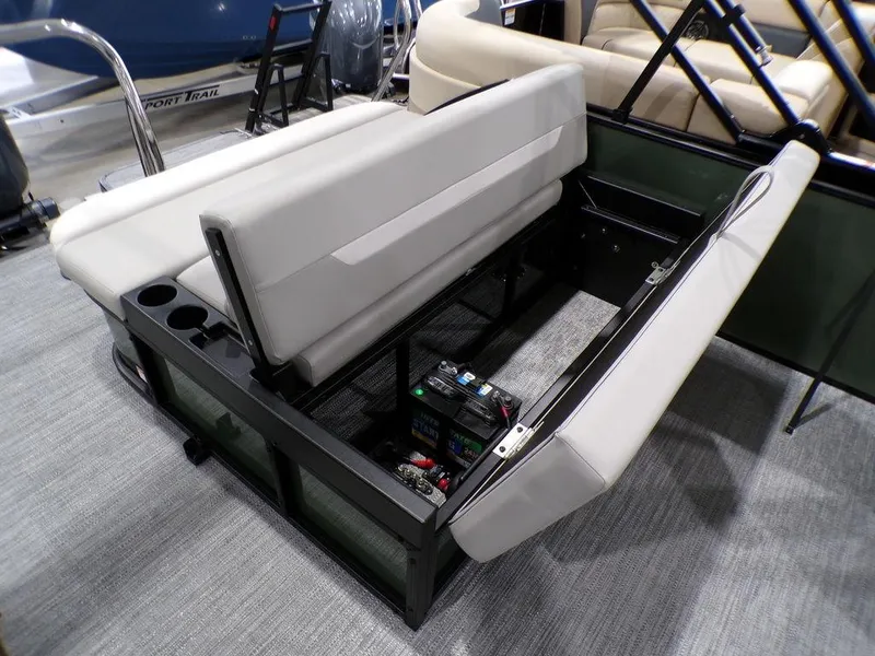 Slide: The Image of 2025 Godfrey Xperience 2286 SFLX boat seat storage with battery compartment and cup holders. - 24