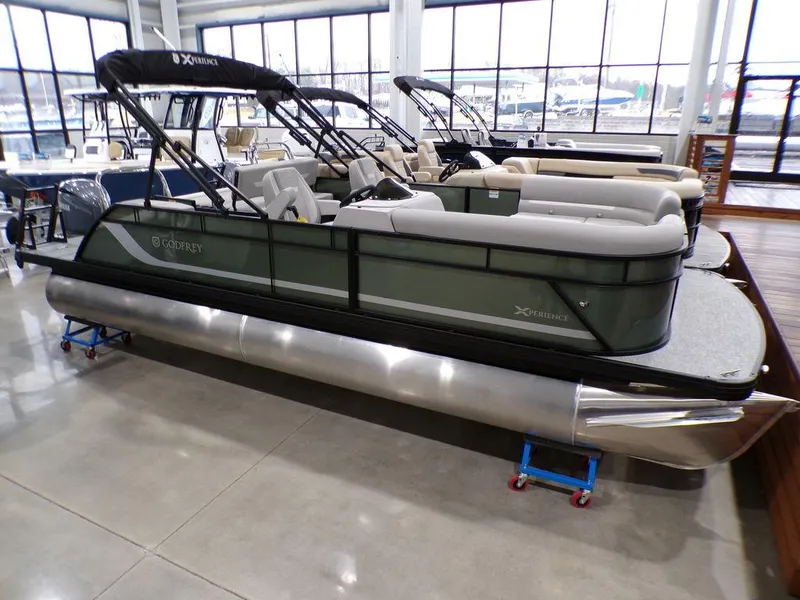 Slide: The Image of 2025 Godfrey Xperience 2286 SFLX pontoon boat displayed indoors. - 4