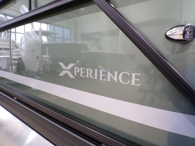 Slide: The Image of 2025 Godfrey Xperience 2286 SFLX boat, close-up of branding and design details. - 5