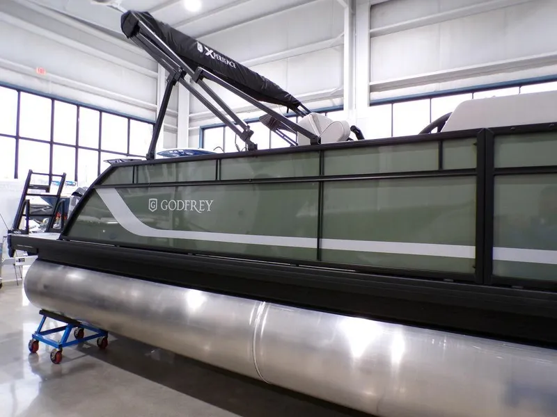 Slide: The Image of 2025 Godfrey Xperience 2286 SFLX pontoon boat in showroom, featuring 27-inch center tube. - 6