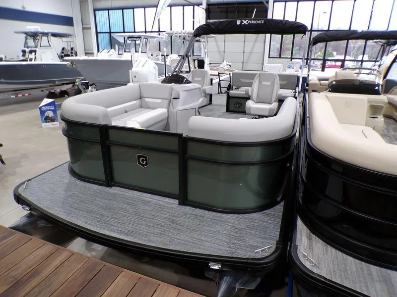 Slide: The Image of 2025 Godfrey Xperience 2286 SFLX pontoon boat with luxurious seating in showroom. - 9