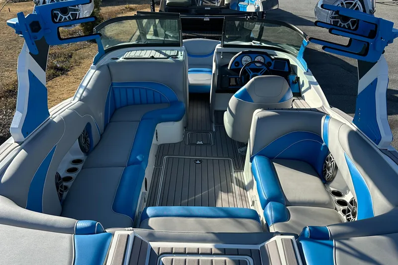 Slide: The Image of 2022 MB B52 23 Alpha boat interior with blue and gray seating, modern design. - 5