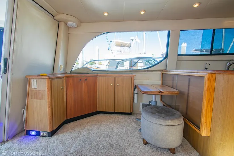 Slide: The Image of Interior of 2001 Bayliner 3788 Command Bridge Motoryacht with wood cabinetry and seating. - 10