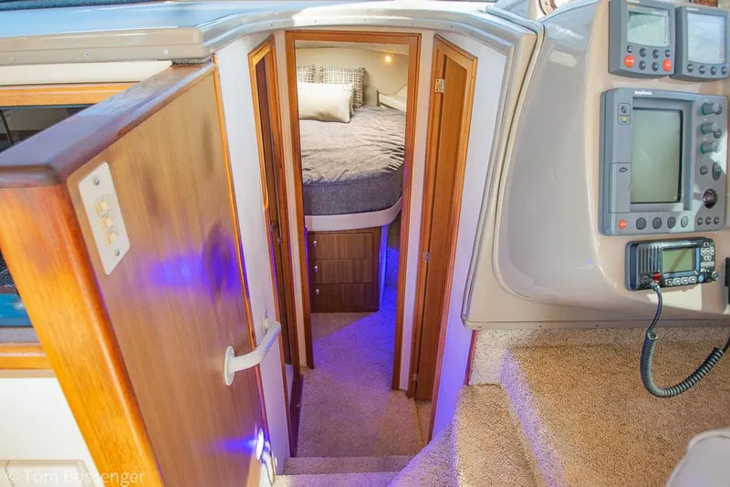 Slide: The Image of 2001 Bayliner 3788 Command Bridge Motoryacht interior with cozy cabin and navigation equipment. - 18